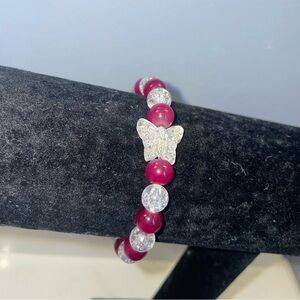 Handmade pink and crackle bead bracelet with butterfly charm